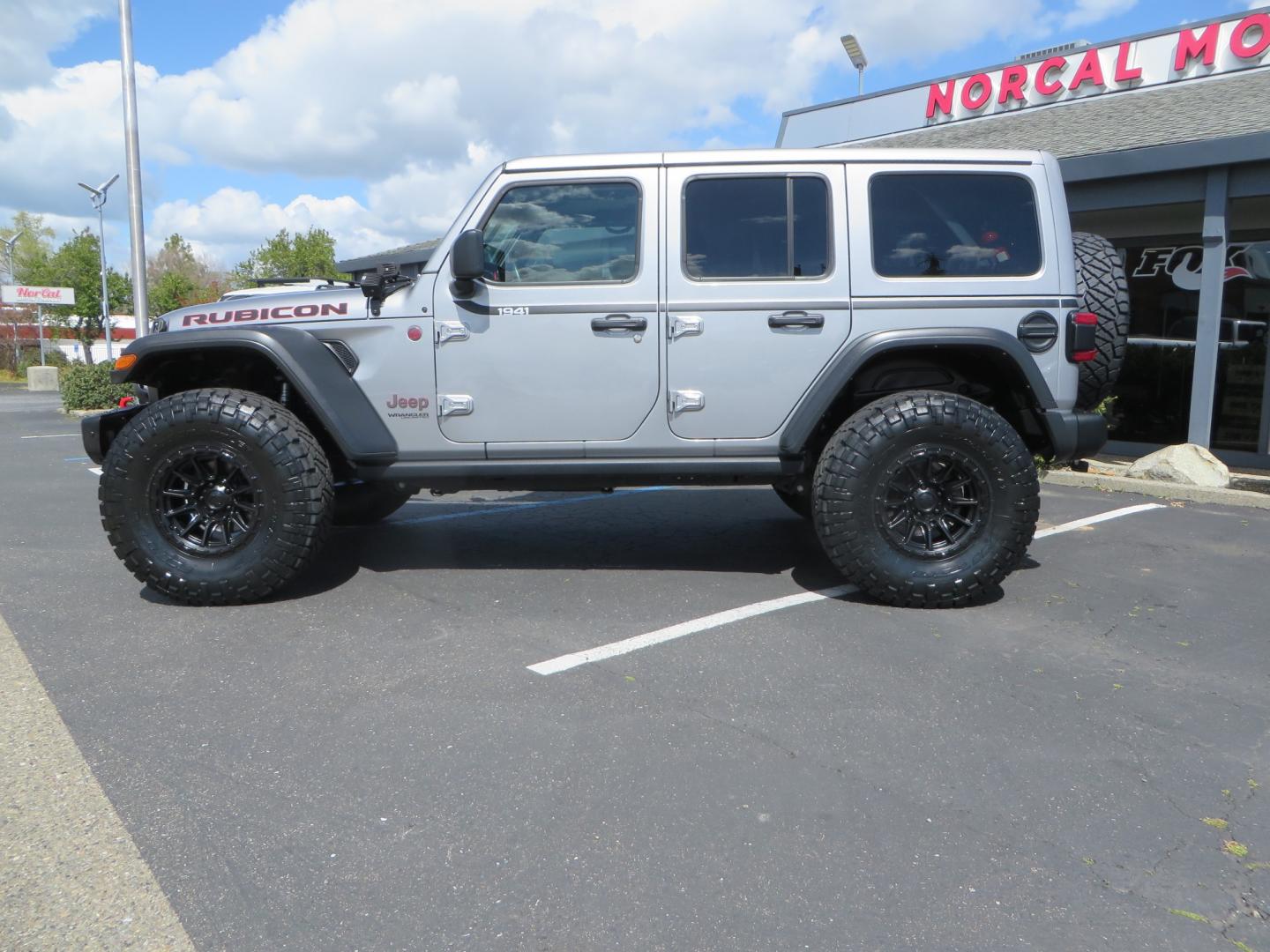 2021 SILVER /BLACK Jeep Wrangler Unlimited Rubicon (1C4HJXFG7MW) with an 3.6L V6 DOHC 24V FFV engine, 6A transmission, located at 2630 Grass Valley Highway, Auburn, CA, 95603, (530) 508-5100, 38.937893, -121.095482 - Features - Zone Offroad 3" Lift kit, Fox shocks, 37" Nitto Ridge Grappler tires, 17" Fuel Piston wheels, Warn winch, KC led lights, Voswitch switches, Teraflex HD tire relocation, Fire extinguisher, High Lift Jack, Shovel, Axe, Jumper Cables, and flat towable. - Photo#7